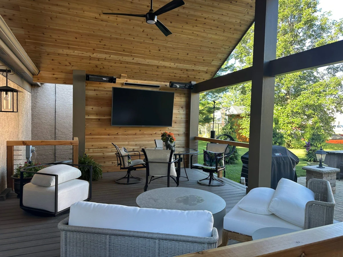 Covered patio with a wood ceiling, ceiling fan and outdoor seating