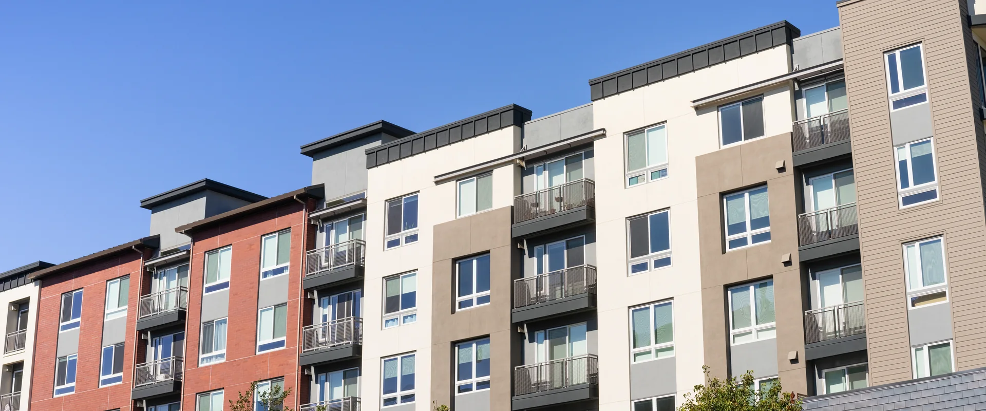 Modern multifamily apartment building exterior with contemporary facades