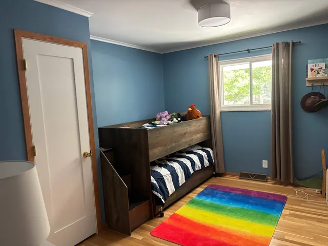 Blue bedroom with wooden bunk bed