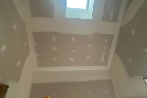 Skylight shaft drywall in progress